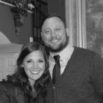 Black-and-white portrait of a smiling couple