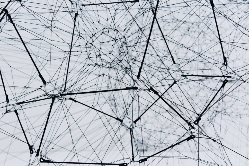 Abstract network of interconnected lines and nodes symbolizing growth pathways in disciple-making, leadership development, and church planting.