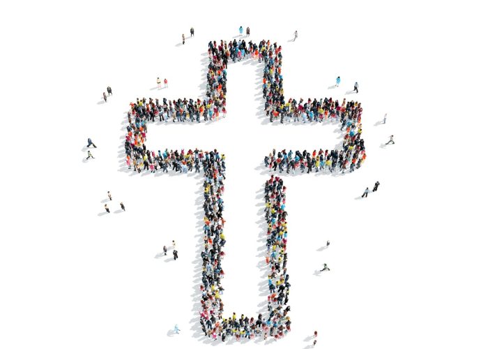 Diverse crowd of people forming a large cross shape, symbolizing faith and community, reflecting the theme of transformation and obedience in Christ.
