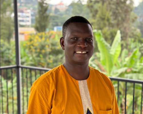 Portrait of young man wearing yellow shirt outdoors