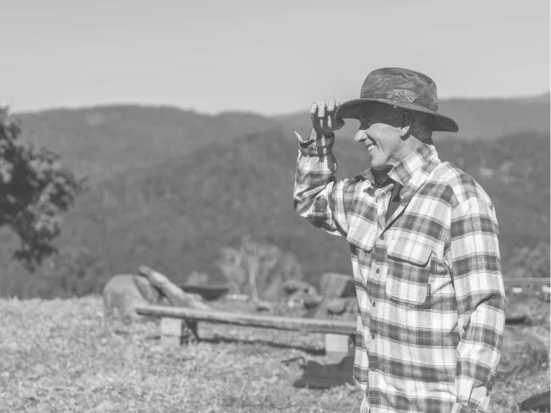 Black and white photograph of person working in a field